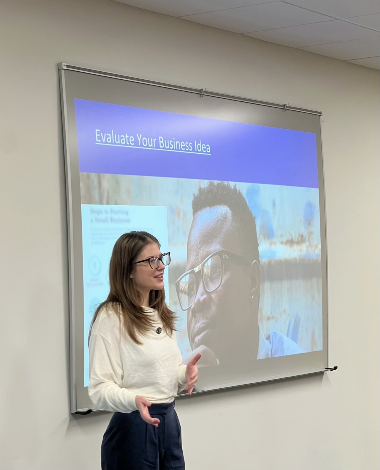 Siera presenting a slide titled Evaluate Your Business Idea.